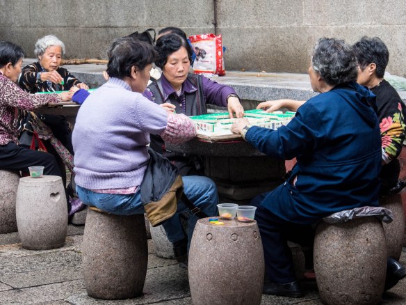 Retired women playing Mahjong
